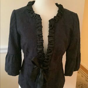 Navy brocade 3/4 sleeve jacket with black satin trim and tie front waist
